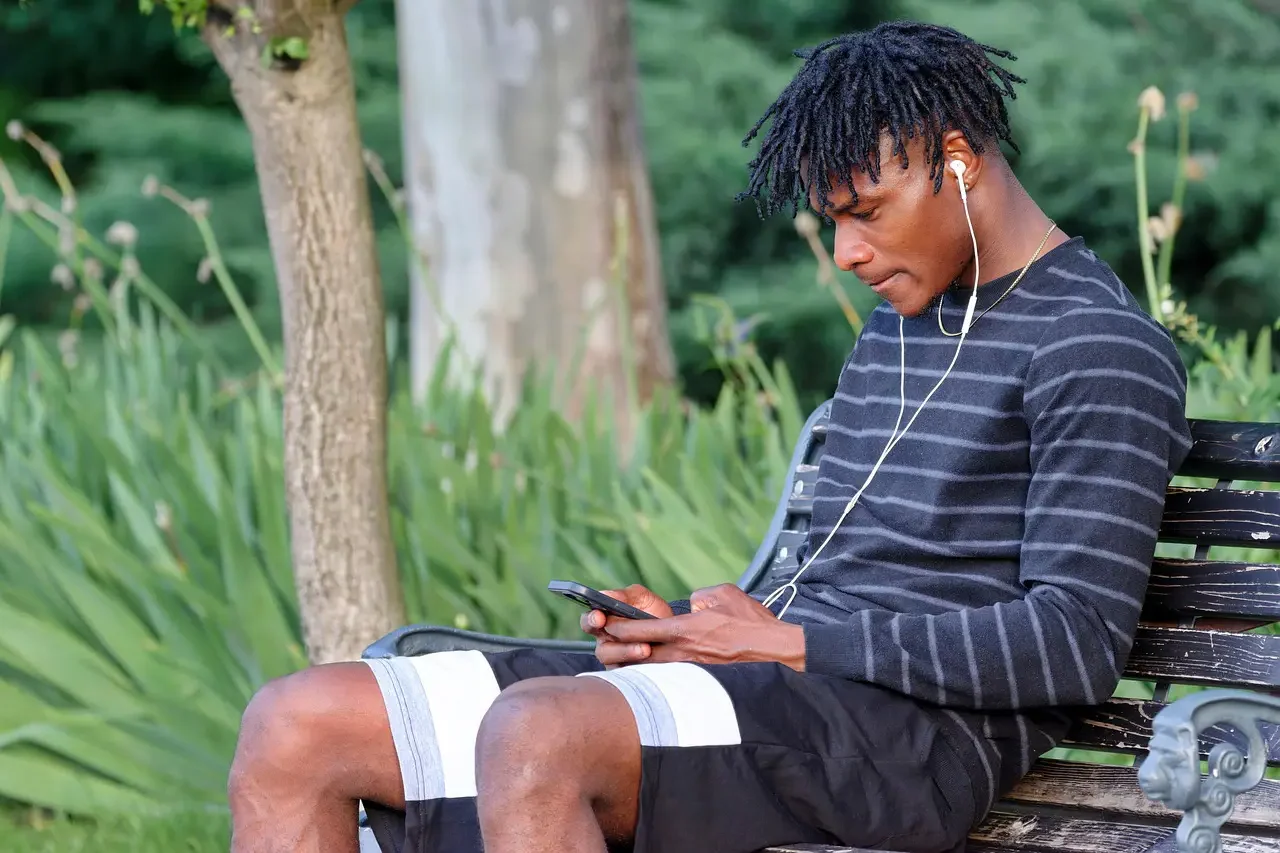 Young adult man gambling on mobile-Parents Standing Together