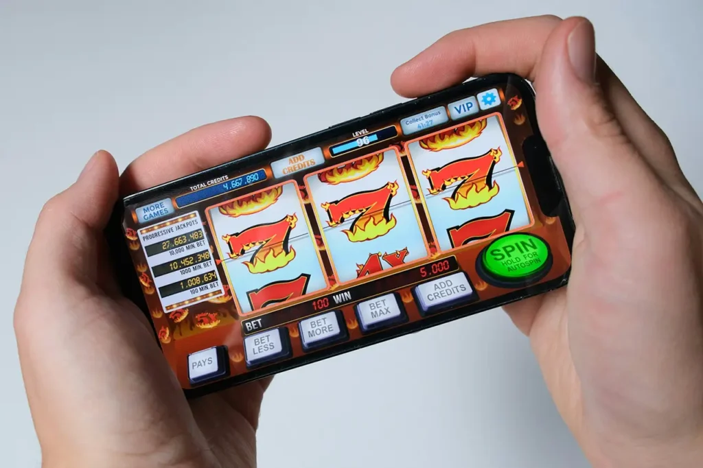 Slot machine game on mobile phone - Parents Standing Together