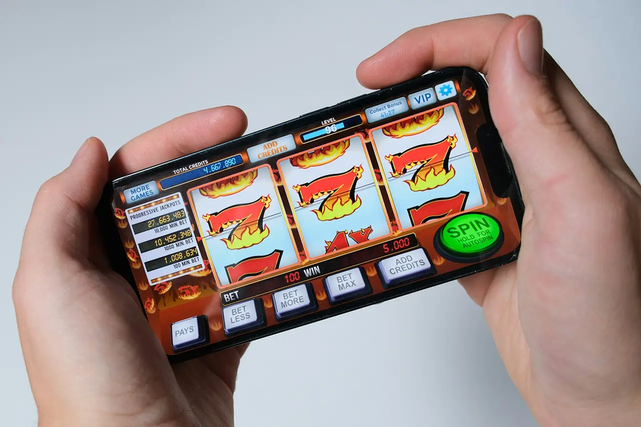 Slot machine game on mobile phone - Parents Standing Together
