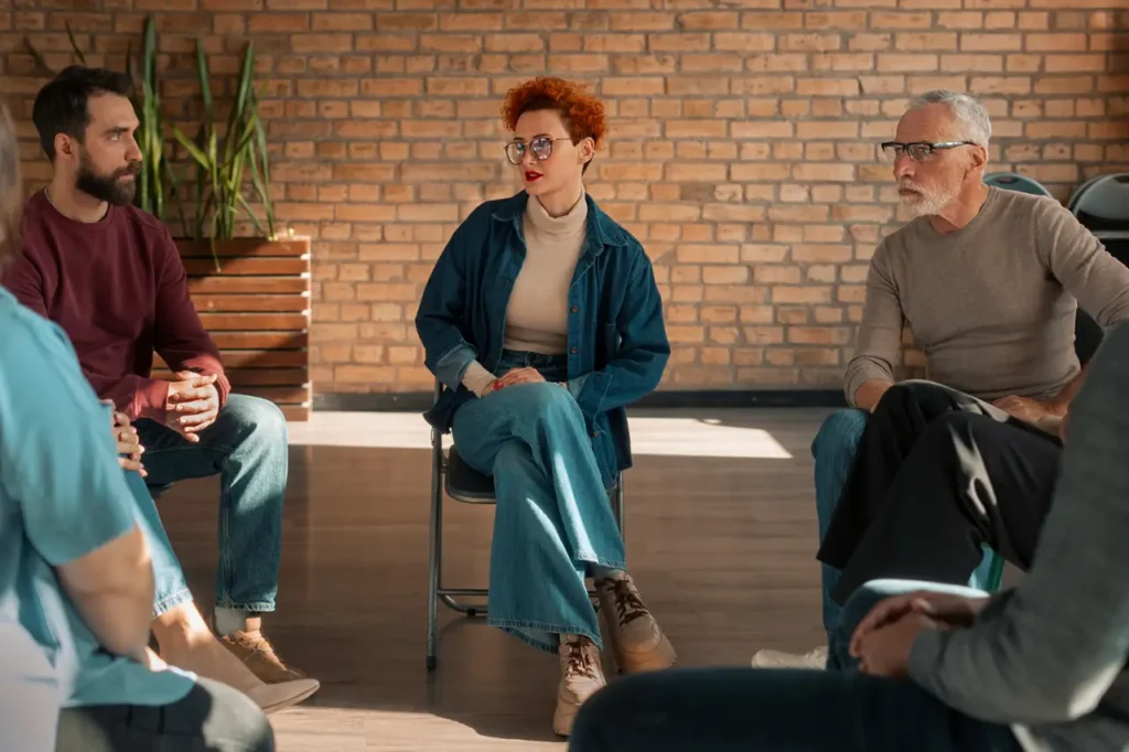 Woman in therapy group child gambling addiction-Parents Standing Together