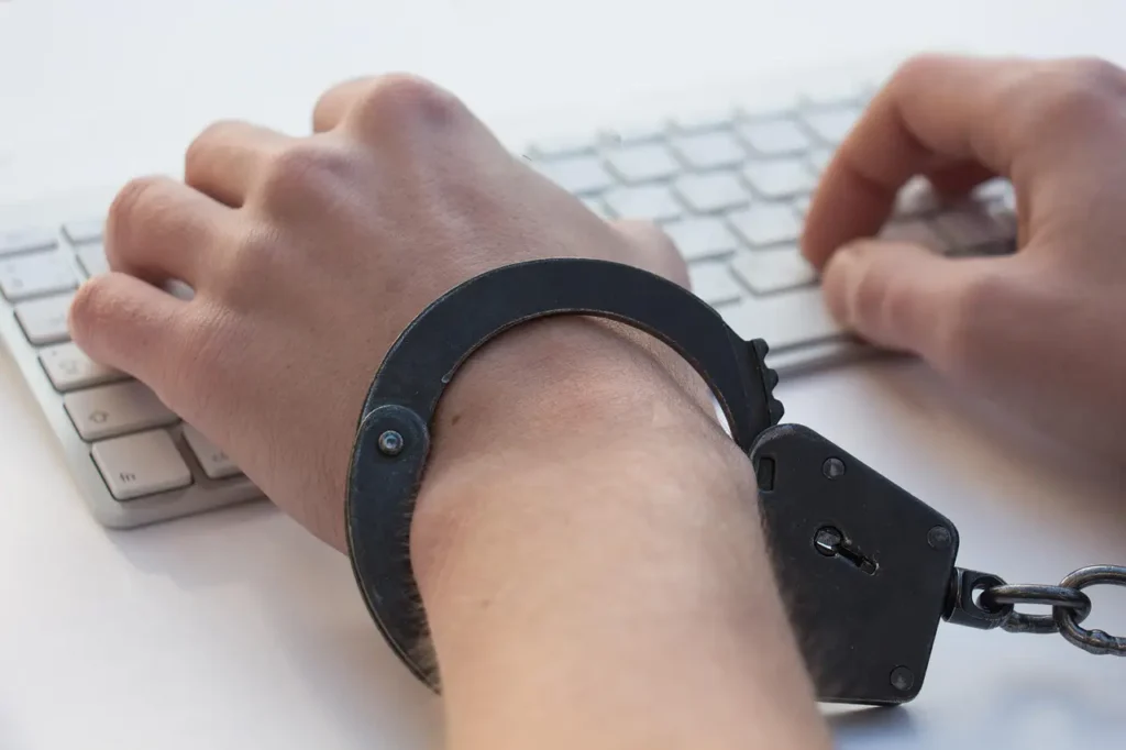 Handcuffs on boy with keyboard problem gambling-Parents Standing Together